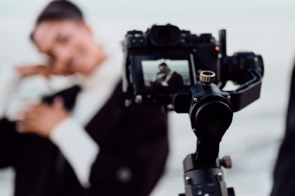 Attractive African American girl posing on camera during photo session by the sea